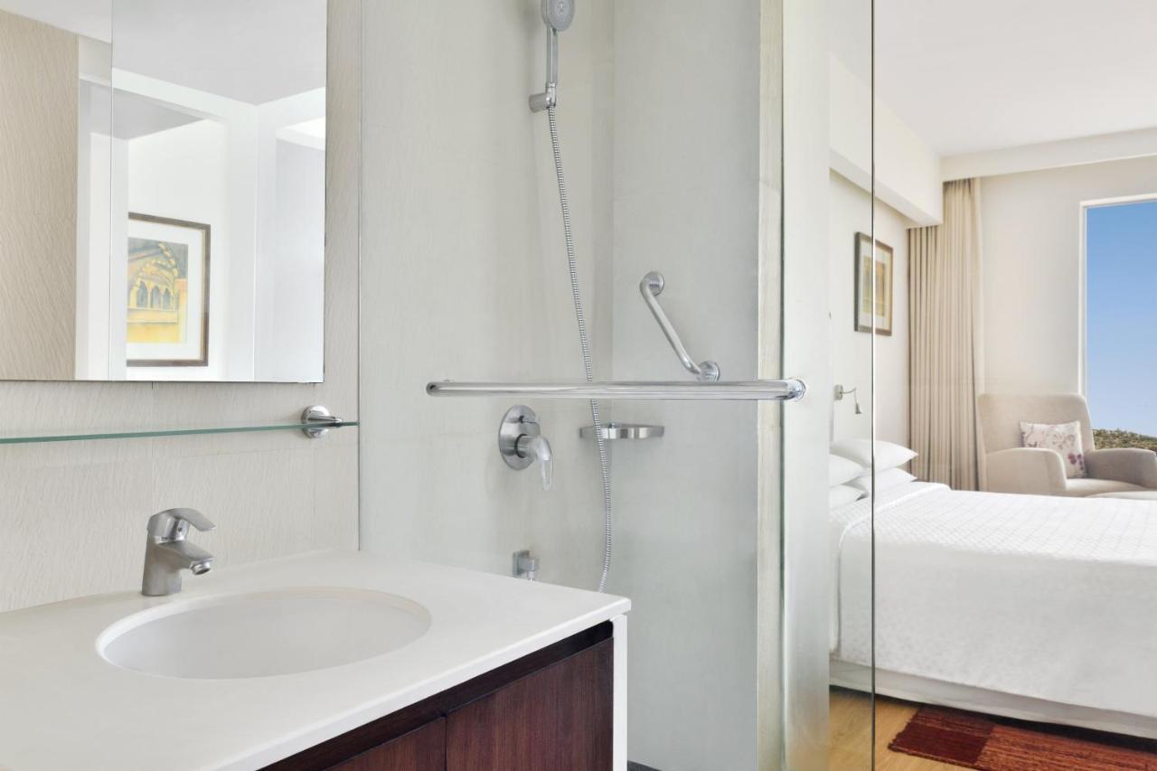 Deluxe Twin Room ( 20% Dis on SPA, Laundry and Food & Soft Beverages only at The Eatery, Credit Meal of INR 1000/- in a the stay on Minimum bill amount of INR 2500/-),1419914169:JPEG