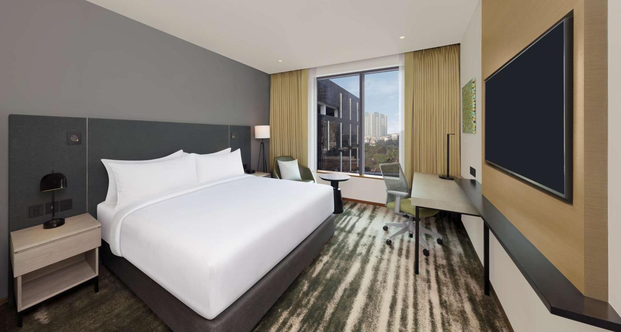 Deluxe King Suite with One-Way Airport Transfer
